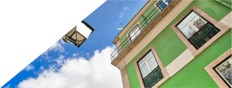 Fachada de casa de cor verde